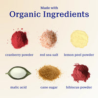 Oral Zen's ingredients including cranberry powder, red sea salt, lemon peel powder, malic acid, cane sugar, and hibiscus powder on a beige background.