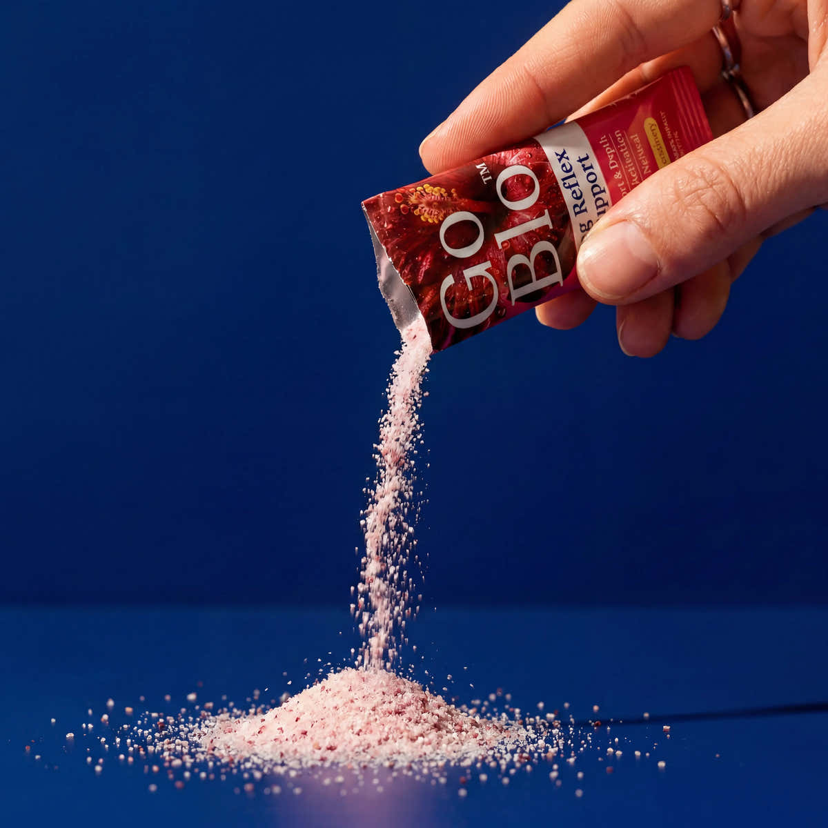 GoBlo lemon-cranberry powder pouring from a stick pack