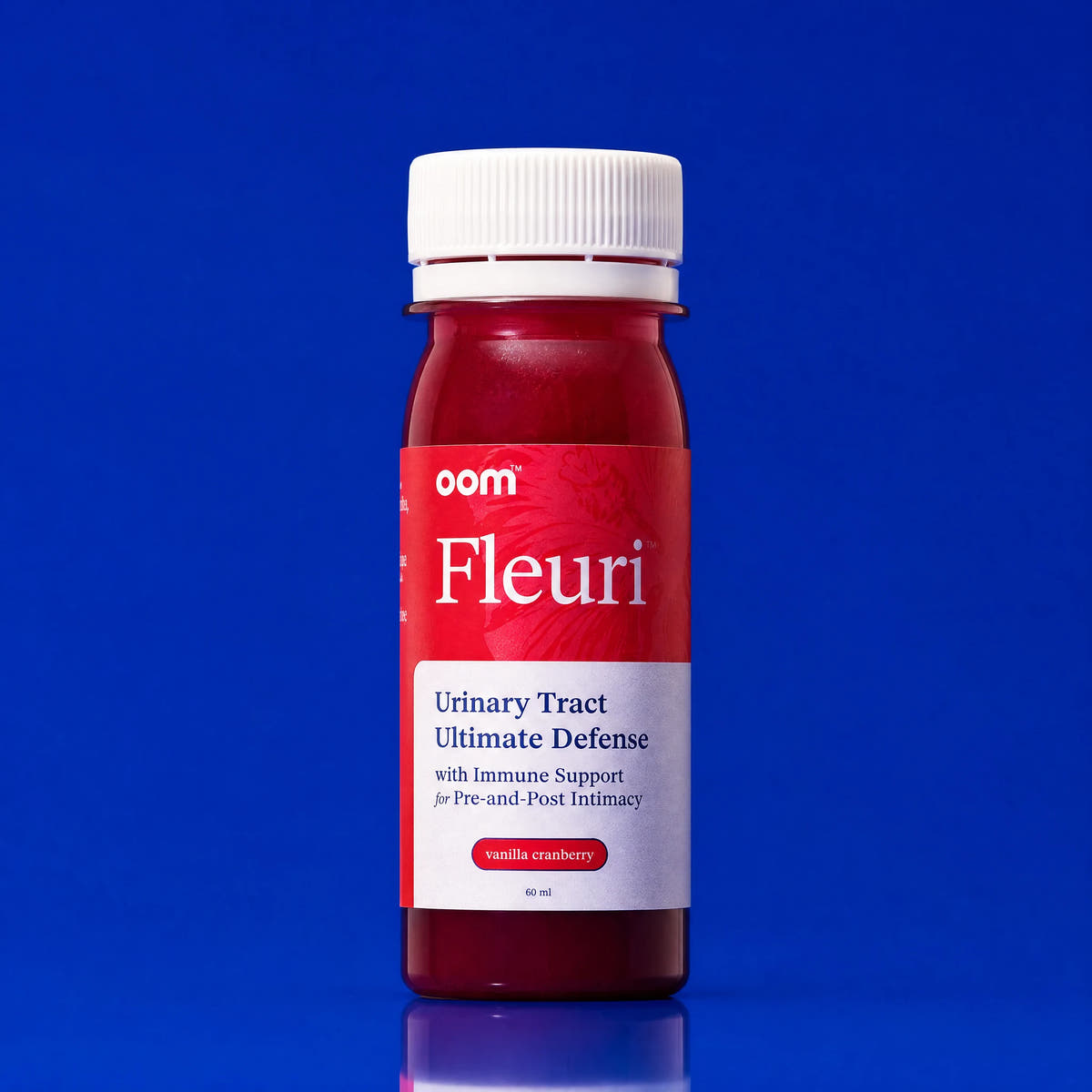 Fleuri Urinary Defense Shot on a Klein blue background